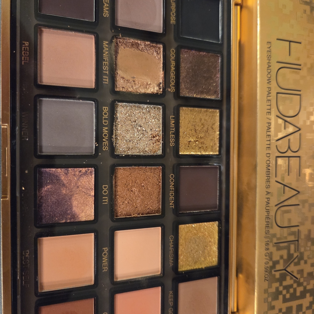 HUDA BEAUTY Eyeshadow Palette with Gold, Purple, and Brown Tones